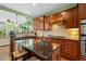 Modern kitchen featuring granite countertops and stainless steel appliances at 5400 Heatherton Ln, Highlands Ranch, CO 80130