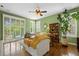 Bright living room featuring large windows and hardwood flooring at 5400 Heatherton Ln, Highlands Ranch, CO 80130