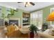 Inviting living room with a cozy fireplace and plenty of natural light at 5400 Heatherton Ln, Highlands Ranch, CO 80130