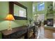 Inviting entryway showcasing hardwood floors, tall ceilings, and seamless flow to dining and living areas at 5400 Heatherton Ln, Highlands Ranch, CO 80130