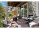 Cozy covered patio featuring a built-in grill, hanging swing, and inviting fire pit at 5400 Heatherton Ln, Highlands Ranch, CO 80130