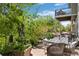 Charming outdoor patio area with dining set and lush greenery, ideal for entertaining at 5400 Heatherton Ln, Highlands Ranch, CO 80130