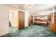 Basement bedroom featuring blue carpets and wooden furniture at 798 Xenophon St, Lakewood, CO 80401