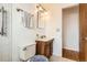 Bathroom featuring a single vanity, toilet and walk-in shower at 798 Xenophon St, Lakewood, CO 80401