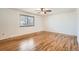 Bright bedroom with hardwood floors, a ceiling fan, one window, and neutral walls at 798 Xenophon St, Lakewood, CO 80401