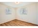 Bright bedroom featuring hardwood floors and dual windows for ample natural light at 798 Xenophon St, Lakewood, CO 80401