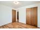 Bedroom featuring hardwood floors and a spacious closet at 798 Xenophon St, Lakewood, CO 80401