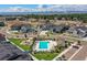 Stunning aerial view of community, showcasing pool, playground, and mountain views at 2023 S Upham Way, Denver, CO 80227