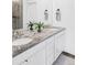 Bathroom with dual sinks and granite countertop at 2023 S Upham Way, Denver, CO 80227