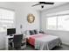 Bright bedroom featuring a desk, large windows, and natural lighting at 2023 S Upham Way, Denver, CO 80227