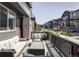 Cozy front porch with comfortable seating, perfect for relaxing and enjoying the neighborhood views at 2023 S Upham Way, Denver, CO 80227