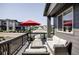 Charming front porch with comfortable outdoor seating, perfect for relaxing and enjoying the neighborhood view at 2023 S Upham Way, Denver, CO 80227