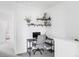 Upstairs office nook with shelves and a view of the bedroom at 2023 S Upham Way, Denver, CO 80227