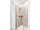 Glass enclosed shower features tiled walls and modern fixtures at 2023 S Upham Way, Denver, CO 80227