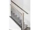 Carpeted staircase with a wooden handrail and black metal balusters offers a modern, elegant look at 2023 S Upham Way, Denver, CO 80227