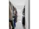 Bright walk-in closet featuring custom shelving and a window for natural light at 2023 S Upham Way, Denver, CO 80227