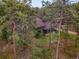 A charming home nestled in a tranquil forest setting with mature trees and ample privacy at 26765 Bradley St, Conifer, CO 80433