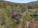 A charming home nestled in a tranquil forest setting with mature trees and ample privacy at 26765 Bradley St, Conifer, CO 80433
