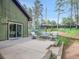 Relaxing back patio with a sofa, chairs and table with a sliding door entry into the home at 26765 Bradley St, Conifer, CO 80433