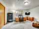 Bedroom featuring a large desk, office furniture, a TV and secure safe at 26765 Bradley St, Conifer, CO 80433