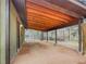 Attached covered parking area with room for multiple vehicles, and a gated entrance to the property at 26765 Bradley St, Conifer, CO 80433