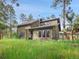 Charming single-Gathering home on a large lot with mature trees, lush grass, and a large front yard at 26765 Bradley St, Conifer, CO 80433
