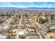 Beautiful aerial view of the house surrounded by the neighborhood, with mountain views in the background at 4730 W Moncrieff Pl, Denver, CO 80212