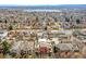 Wide aerial shot showing the house nestled in a neighborhood with a lake visible in the distance at 4730 W Moncrieff Pl, Denver, CO 80212