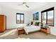 Bedroom with carpet floors, an accent wall, and large window for plenty of natural light at 4730 W Moncrieff Pl, Denver, CO 80212