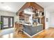 Modern kitchen with a spacious island, granite countertops, stainless appliances, and dark trimmed doors at 4730 W Moncrieff Pl, Denver, CO 80212