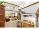 Spacious living area with stairs leading to a mezzanine bedroom, complete with stylish furnishings and decor at 4730 W Moncrieff Pl, Denver, CO 80212