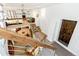 Unique living space featuring a mezzanine bedroom, modern staircase, and bright, open floor plan at 4730 W Moncrieff Pl, Denver, CO 80212