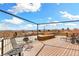 Rooftop deck with lounge chairs and a seating area showcasing mountain views at 4730 W Moncrieff Pl, Denver, CO 80212