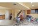 Finished basement with stairs, toys, storage, and wet bar at 10295 Ravenswood Ln, Highlands Ranch, CO 80130