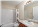 Bright bathroom featuring tub, shower, and sink with a spacious vanity and neutral tones at 10295 Ravenswood Ln, Highlands Ranch, CO 80130