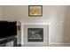 Bright fireplace with tiled hearth and decorative mantle, perfect for cozy evenings at 10295 Ravenswood Ln, Highlands Ranch, CO 80130