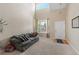 Bright living room with soaring ceilings and large windows offering great natural light at 10295 Ravenswood Ln, Highlands Ranch, CO 80130