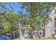 Charming townhouse with stone accents, large windows, and mature trees in a residential neighborhood at 1325 S Idalia St, Aurora, CO 80017
