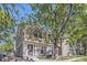 Inviting townhouse with stone accents and lush trees creating a warm, neighborhood feel at 1325 S Idalia St, Aurora, CO 80017
