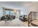 Cozy living room featuring neutral carpet, staircase, and ample natural light at 1325 S Idalia St, Aurora, CO 80017