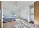 Spacious main bedroom boasts a ceiling fan, closet, and a window offering ample natural light at 1325 S Idalia St, Aurora, CO 80017