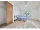 Bright main bedroom offers a ceiling fan, closet and a sunlit window at 1325 S Idalia St, Aurora, CO 80017