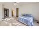 Sunny main bedroom featuring large window, ceiling fan, closet and easy access to ensuite bath at 1325 S Idalia St, Aurora, CO 80017