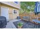 Private back patio area with table, chairs, umbrella, and fenced-in yard at 1325 S Idalia St, Aurora, CO 80017