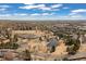 Overhead view featuring a neighborhood park with a pond and trails at 6616 Zinnia St, Arvada, CO 80004