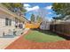 Backyard featuring a lush lawn, new storage shed and seating area at 6616 Zinnia St, Arvada, CO 80004