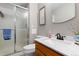 Bathroom features a marble countertop, vanity and shower at 6616 Zinnia St, Arvada, CO 80004
