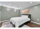 Cozy bedroom with a comfortable bed, and a gray rug at 6616 Zinnia St, Arvada, CO 80004