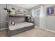 Bedroom features a bunk bed and a window at 6616 Zinnia St, Arvada, CO 80004