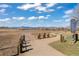 Scenic view of the open space with a walking trail and distant mountain views under a blue sky at 6616 Zinnia St, Arvada, CO 80004